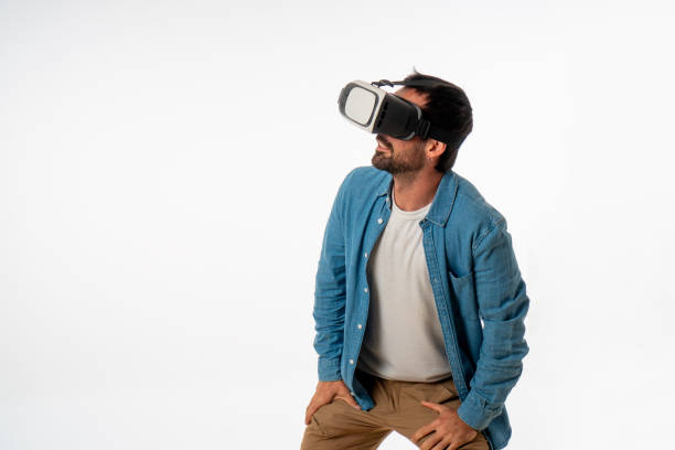 istock young handsome man with virtual reality goggles on white background. studio photo 1467126649