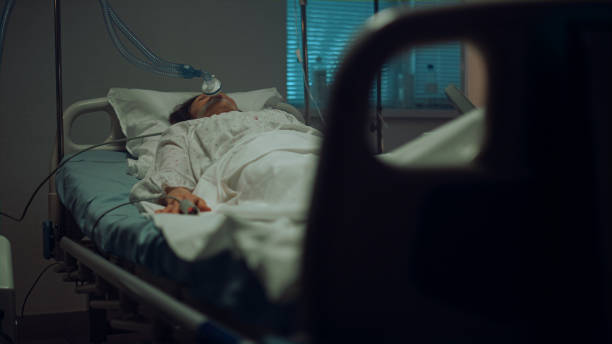 istock Patient connected artificial breathing tubes in hospital intensive care unit. 1467130017