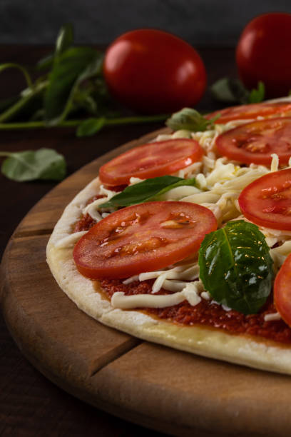 istock Delicious handmade pizza with cheese and different ingredients. homemade dough. rustic style, pepperoni 1467130434