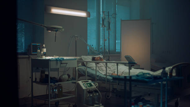 istock Patient lying with oxygen mask in hospital ward. Modern operating room interior. 1467130559