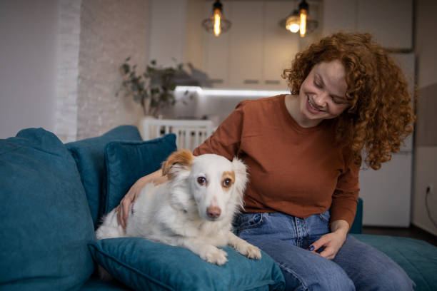 istock Young girl is enjoying with her dog 1467131282