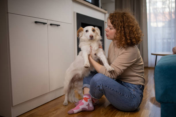 istock Young girl is enjoying with her dog 1467131303