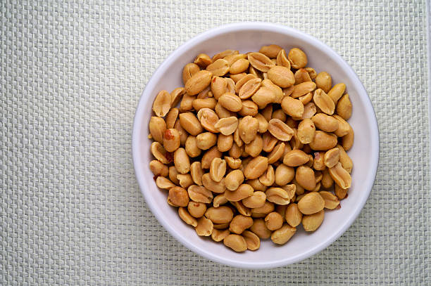 Peanuts in a dish with clipping path stock photo