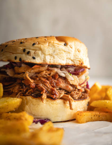 istock pulled pork sandwich with cabbage and lettuce on a sweet brioche bun 1467131681