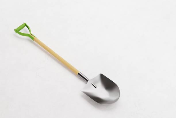 Shovel on a light background. The concept of digging, using a shovel to dig in the ground, ground. 3D render, 3D illustration. shovel in sand stock pictures, royalty-free photos & images