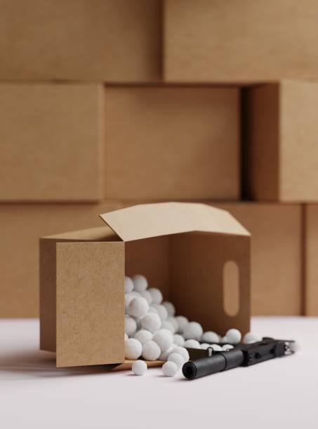 istock Cardboard boxes in the warehouse and one cardboard box that drops a submachine gun. 1467132530