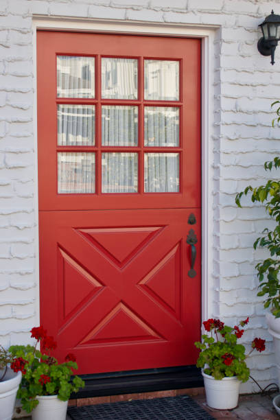 istock Charming cottage with a dark orange front door 1467132598