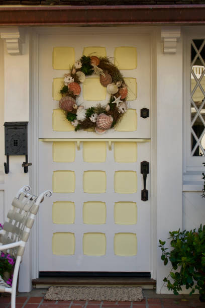 istock Old fashioned front door painted white and yellow 1467133288