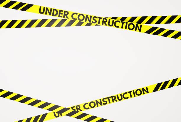 istock Yellow and black warning stripes with the inscription Under Construction. 1467133881