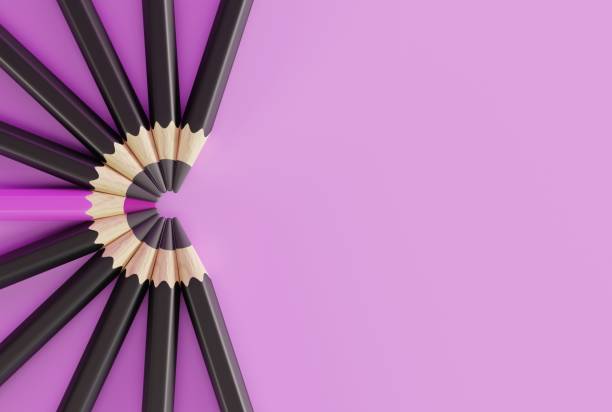 istock Black crayons arranged in a semicircle and one pink crayon. 1467134325