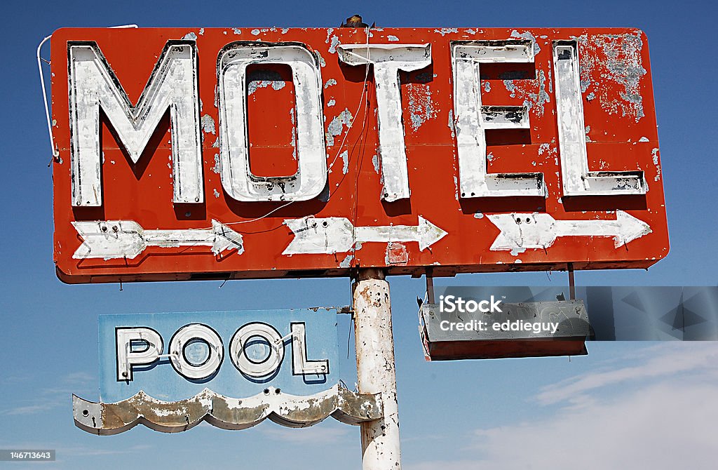 Motel with pool I shot this photo in Arizona at an abandoned motel. I liked the red contrasting the blue sky. Motel Sign Stock Photo