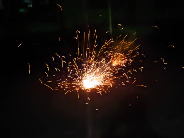 istock New Year Beautiful fireworks splash effect, yellow and red fireworks, black background isolated 1467136450