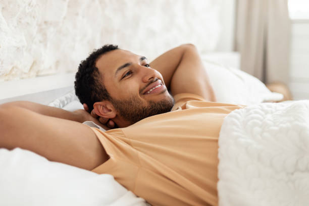 istock Happy Middle Eastern Man Relaxing Lying Resting In Cozy Bedroom 1467140940