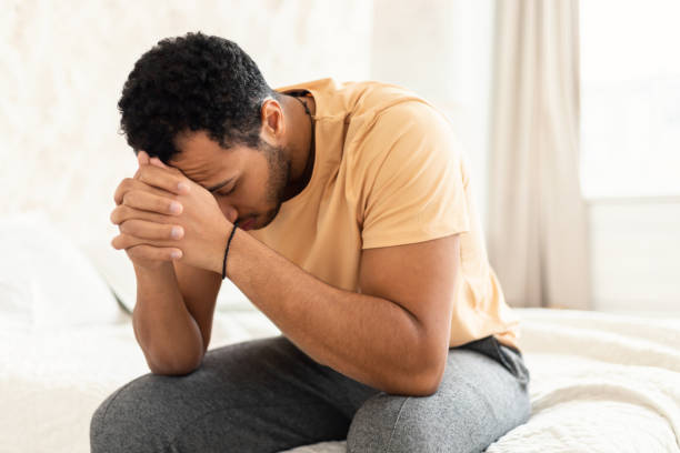 istock Unhappy Middle Eastern Guy Covering Face Having Depression At Home 1467140963