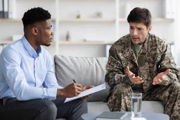 istock Emotional soldier gesturing while talking to psychotherapist 1467141085