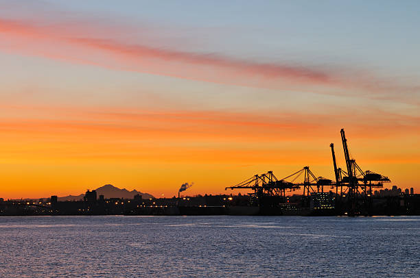 istock shipping crane and mt. baker at sunrise 146714126