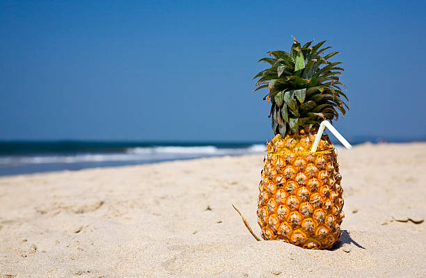 istock fruity cocktail on the beach sand 146714465