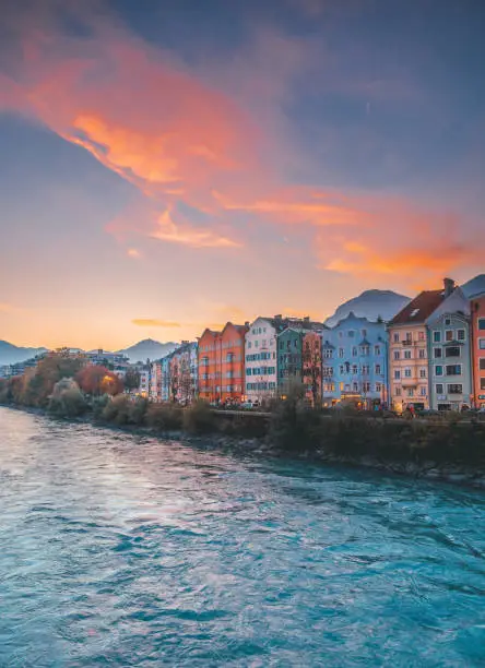 Colorful cityscape of Innsbruck at the Mariahilf district with the beautiful sunrise and mountain chain and Inn river in Austria