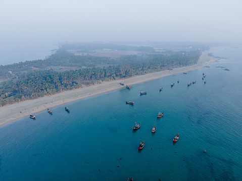 Drone Shot of Saint Martins's Island Bangladesh with Sea Beach Tropical Trees and Fishing Boats. Tourism Economy Travel industry business of Bangladesh