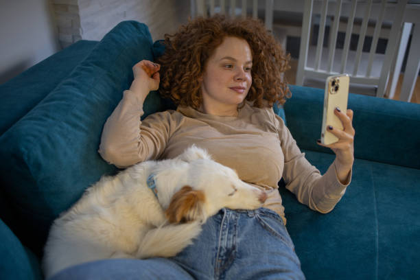 istock Happy young woman using phone 1467148557