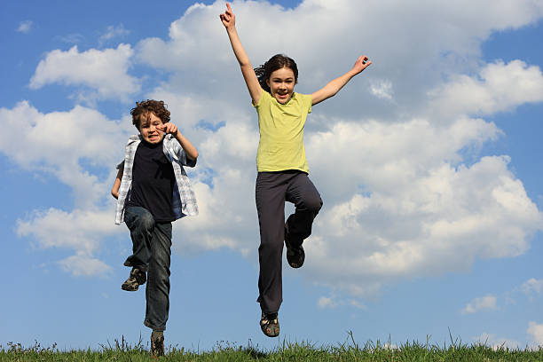 istock Kids jumping outdoor 146714872