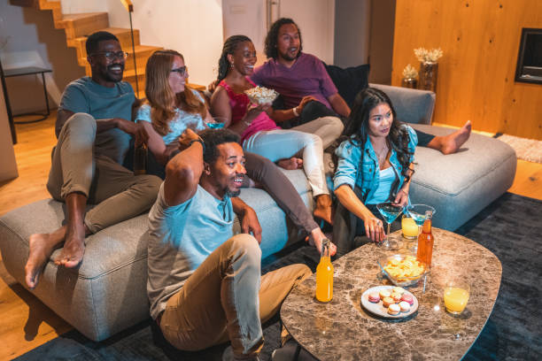 istock Cheerful Multicultural Friends Enjoying A Movie Night 1467150434