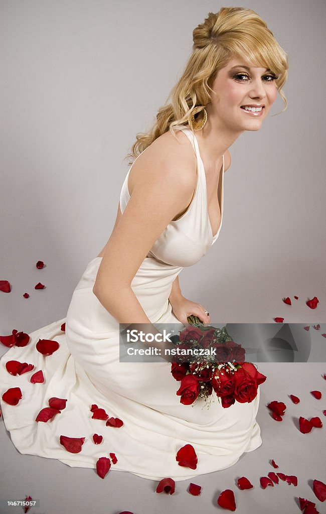 bride on a grey background isolated bride on a grey background with rose paddles and roses Adult Stock Photo