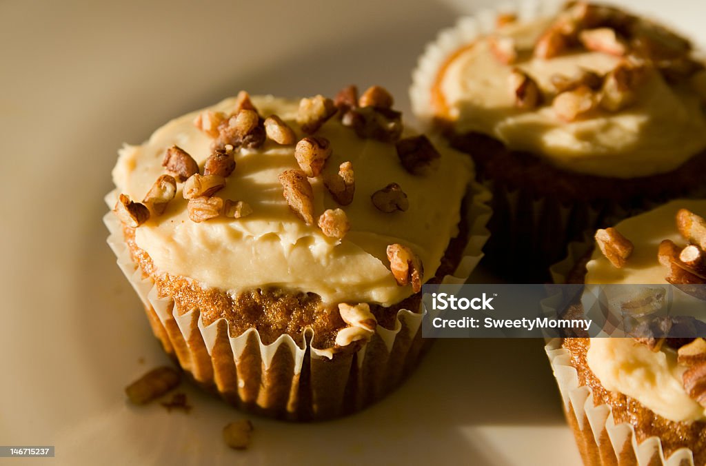 Maple Carrot Muffins Homemade breakfast muffins in contrasting early morning light. Breakfast Stock Photo