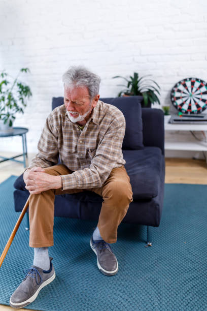 istock A lonely older man with chronic knee problems is desperate while struggling with insufferable pain. 1467153963