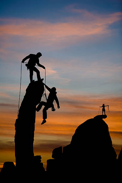 istock Team of climbers reaching the summit. 146715508