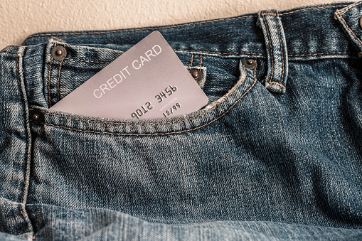 Portrait of jeans with credit card in pocket.