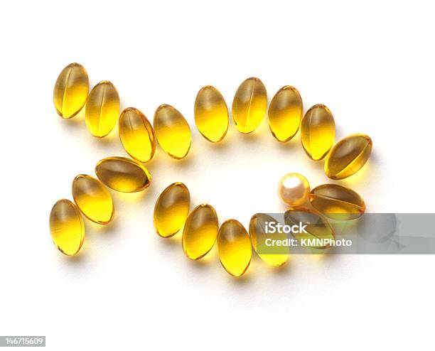 Omega 3 Capsules Forming The Shape Of A Goldfish Stock Photo - Download Image Now - Capsule - Medicine, Cod Liver Oil, Color Image