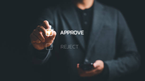 istock Businessman writing or tick correct mark to approve document and project concept, Evaluation form, questionnaire, consideration, acceptance, approval, signing, Quiz, interview. 1467156997