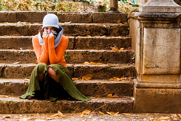 Timid young woman in autumn background