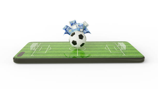 istock 3d rendering of soccer field on mobile phone screen. Moroccan dirham notes behind Football on phone screen. Soccer pitch on smartphone screen isolated on white background. bet and win concept 1467161898