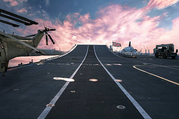 Ready for Action HMS Arc Royal Flagship of British Navy On top of HMS Ark Royal aircraft carrier  at sunset. Taken with a wide angle lens, also now available with Helicopter for a more generic concept battleship photos stock pictures, royalty-free photos & images