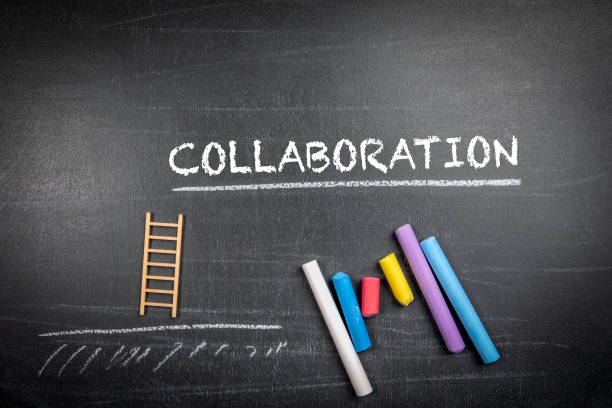 istock COLLABORATION concept. Text and colored pieces of chalk on a blackboard background 1467163852