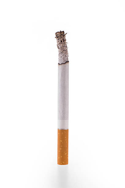 Cigarette burn on white background stock photo