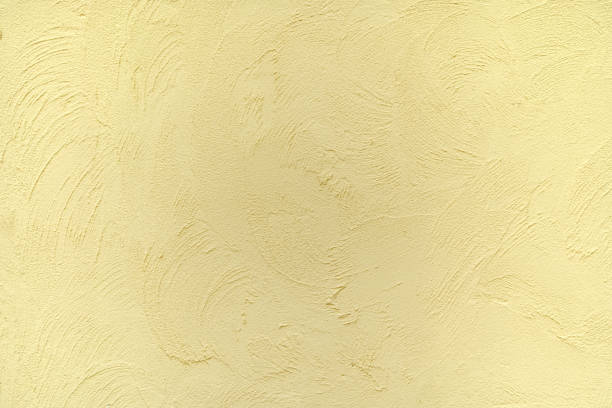 istock brick wall yellow background, Texture plaster backdrop cement concrete, amber mortar abstract rough old solid colors. 1467168317
