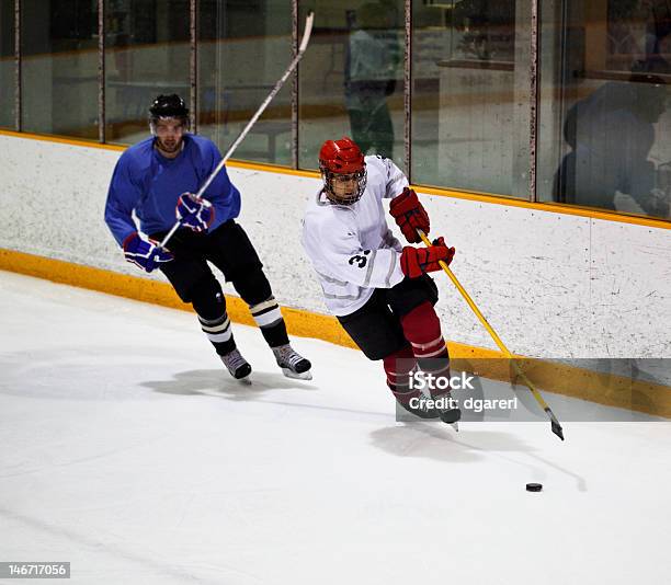 Hockey Players From Opposite Teams Stock Photo - Download Image Now - Men's Ice Hockey, Candid, 20-24 Years