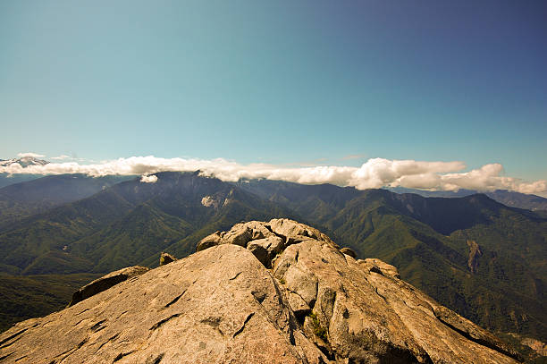 Summit of Moro Rock, looking over the mountain scape and clouds in Giant Sequoia National Park, CA