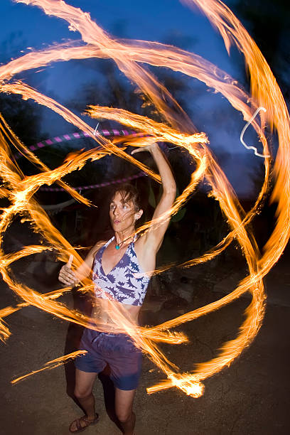 Fire spinning, hoop dancer, performing. stock photo