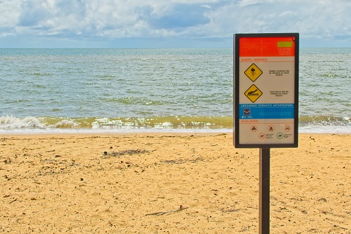 Warning Sign - Marine stingers and crocodiles may be around.