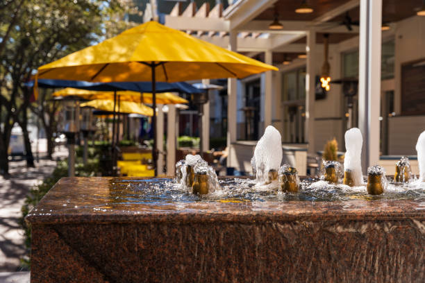 Fountain with Yellow Outdoor Seating from The Shops at Legacy Plano Texas stock photo