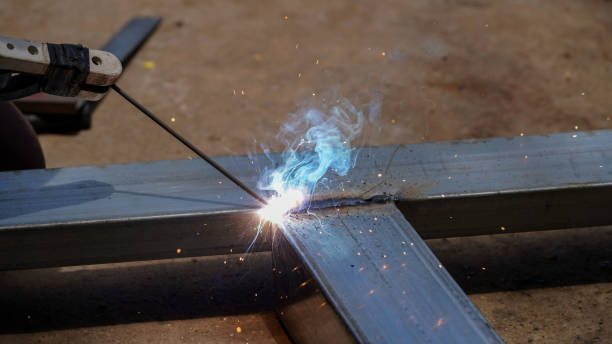 istock Iron soldering, Man working on iron soldering, welding sparks 1467180227