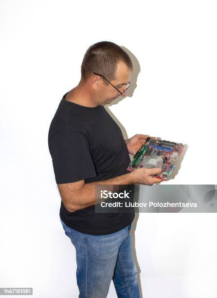 Man With A Computer Board Programmer Computer Technician Stock Photo ...