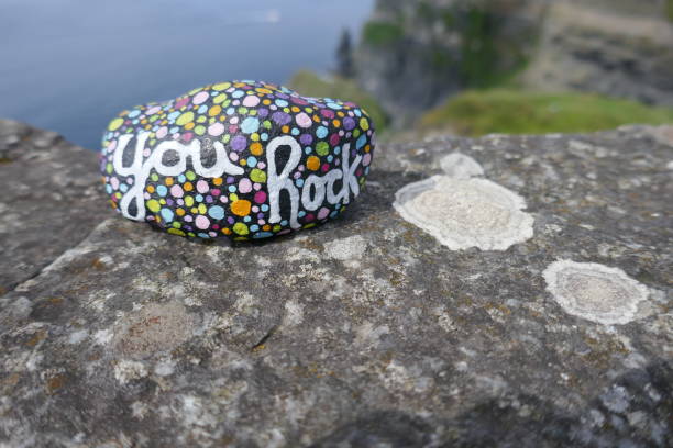 istock Kindness stone with hand painted you rock message on stone with lichens growing 1467181928