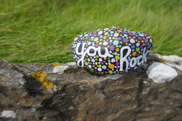istock Inspiring kindness rock with you rock message on old stone wall 1467181929