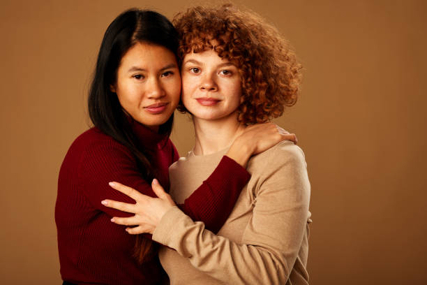 istock Diversity. A multiracial girls hugging and posing in studio. 1467187983