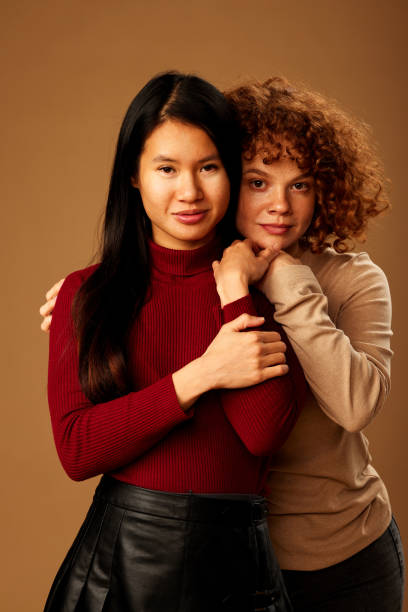 istock Diversity. A multiracial girls hugging and posing in studio. 1467187992